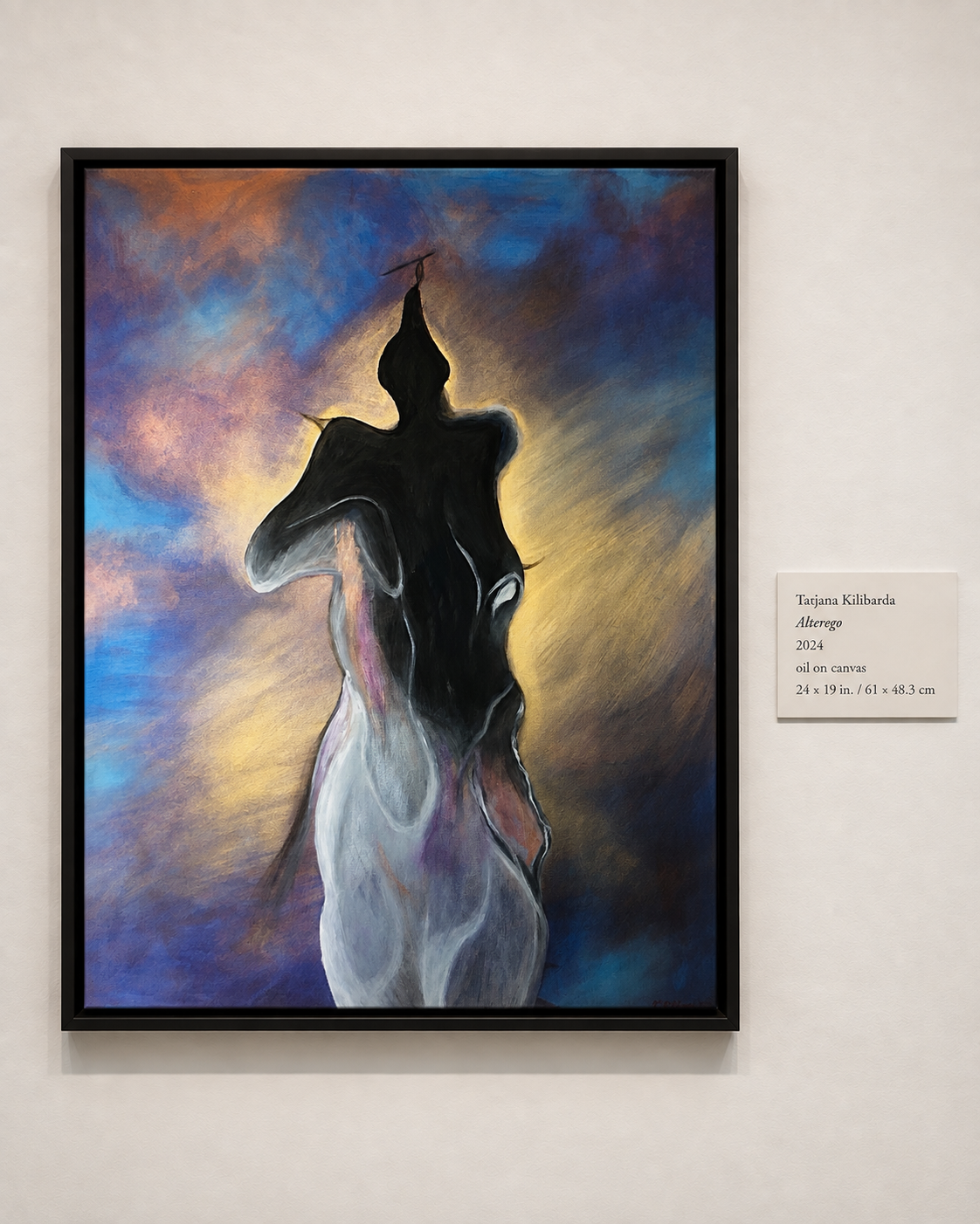 Alter Ego displayed on a gallery wall beside its exhibition label.